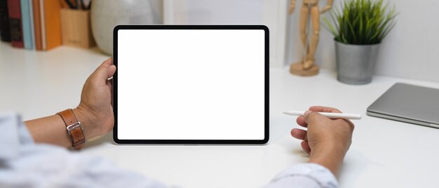 close up view of male entrepreneur using tablet