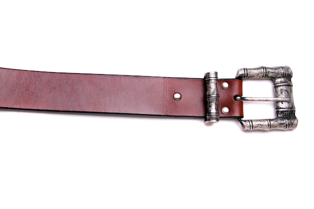 Photo close up view of a man's belt isolated on a white background.