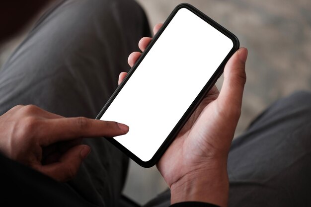 close up view man using mobile phone in living roomx9xa