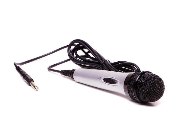 Photo close up view of a microphone isolated on a white background.