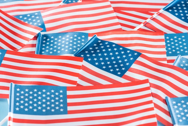 Photo close up view of national colorful american flags in pile