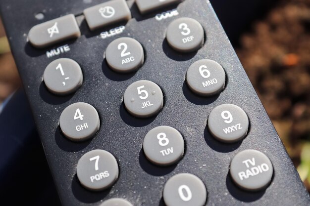 Photo close up view on the number keys of a tv remote control