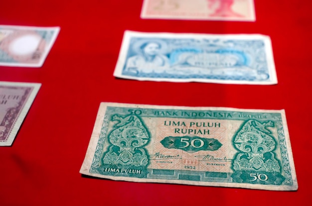 Close up view of old Indonesian banknotes Old rupiah currency money concept Selected focus