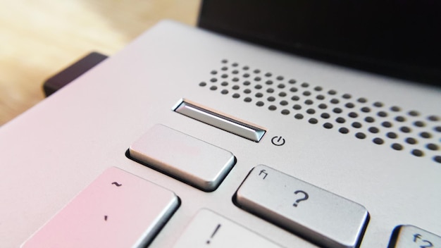 Close up view of power button on computer laptop