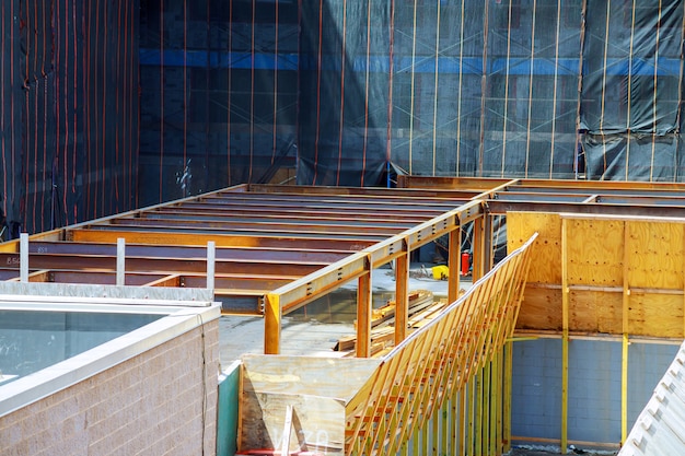 Close up view of reinforcement of concrete with metal rods connected by wire. 