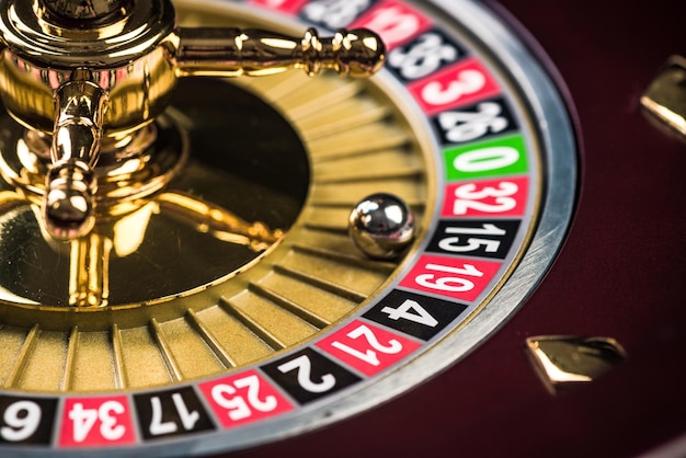 Photo close up view on roulette drum with lucky numbers casino theme