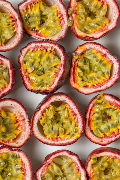 Close up view of sliced passion fruits isolated on a white background.