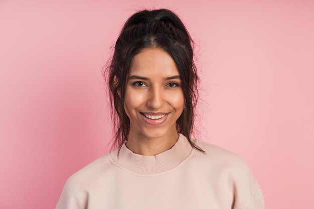 Close-up view of a smiling, attractive brunette  .