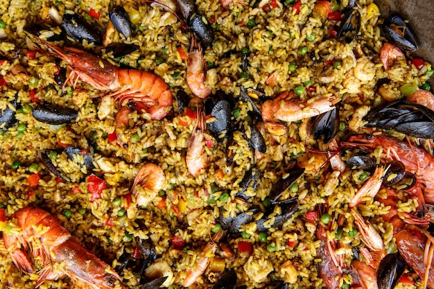 Close up view of a spanish seafood paella mussels king prawns langoustine haddock