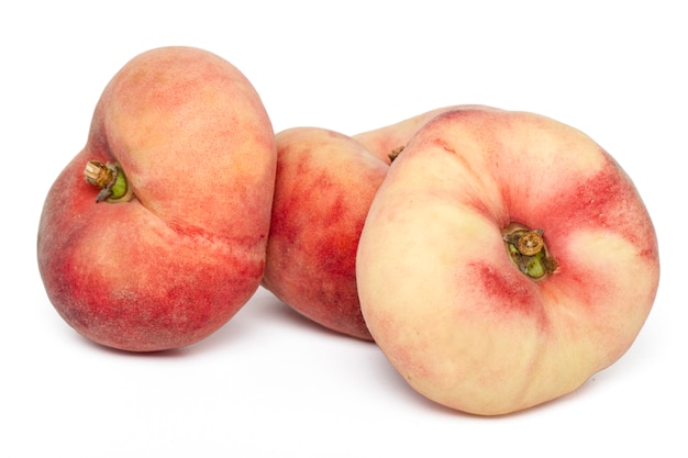 Close up view of tasty paraguayo peaches isolated on a white background.