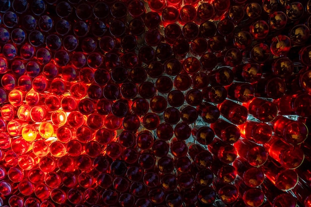 Close up view of thick red glass with light