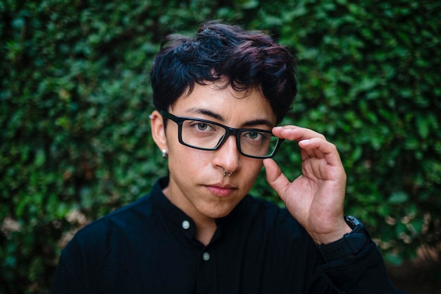 close-up view of a transgender person posing on natural background