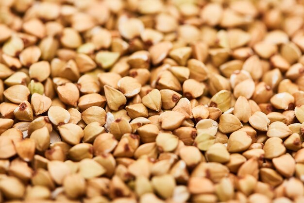 Close up view of uncooked raw buckwheat seeds