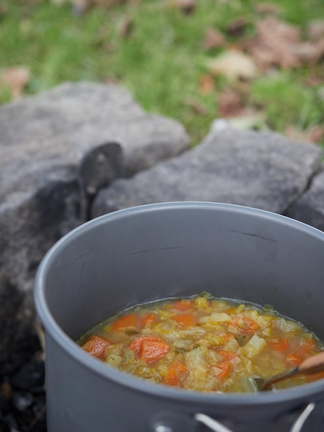 Close up view of vegetable soup on a pot outdoor