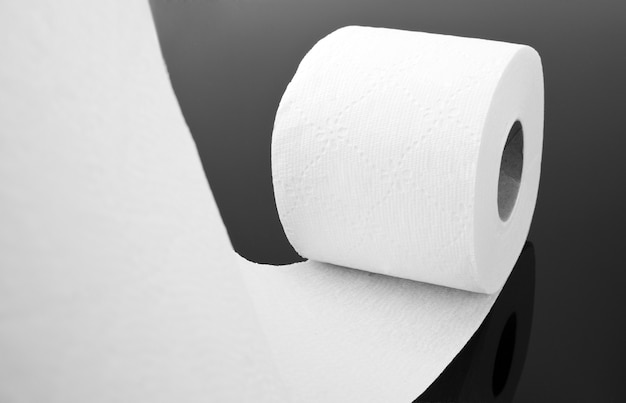 Close-up view of white toilet paper roll