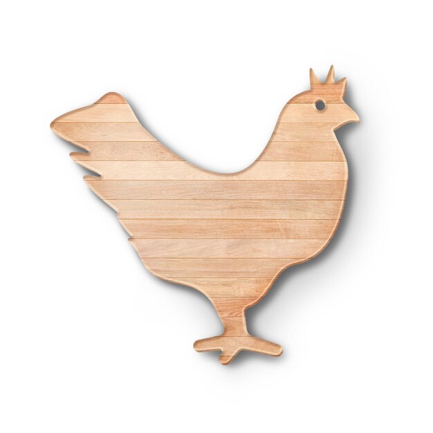 Фото Близкий вид деревянной доски для резки с формой курицы, подходящей для кухонной концепции