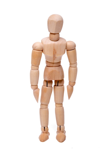 Close up view of a wooden dummy isolated on a white background.