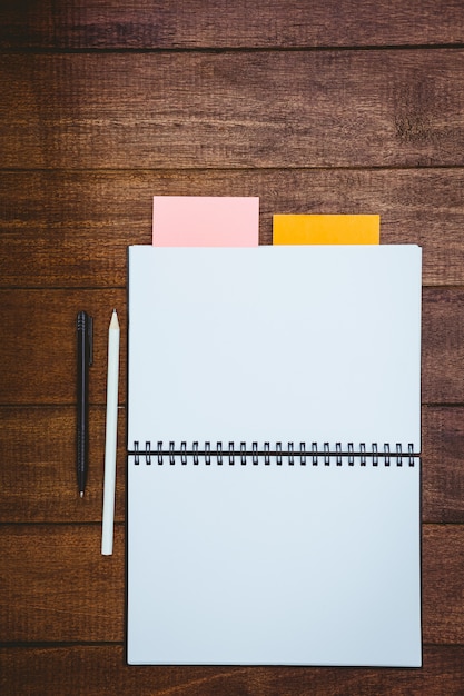 Close up view of a workbook on wood desk