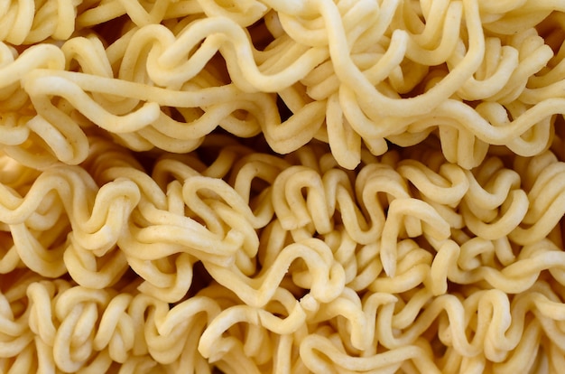 Close up view of yellow dry instant noodles. Chinese traditional food 