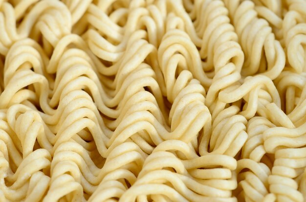 Close up view of yellow dry instant noodles. Chinese traditional food