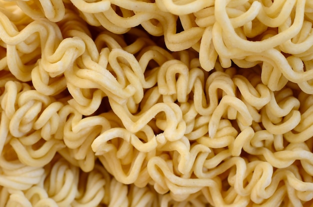 Close up view of yellow dry instant noodles. Chinese traditional food