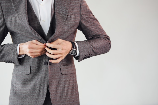 Close up view Young stylish businessman in suit indoors Conception of success