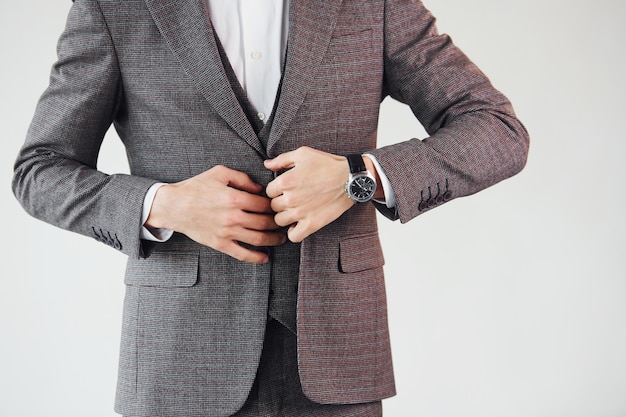 Close up view Young stylish businessman in suit indoors Conception of success