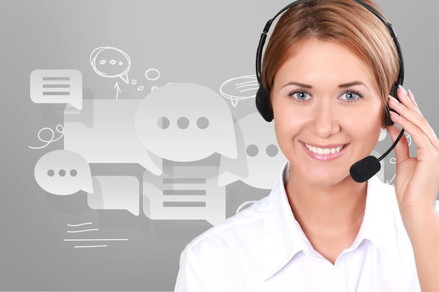 Close-up view of young woman face with headphones, call center\
or support concept