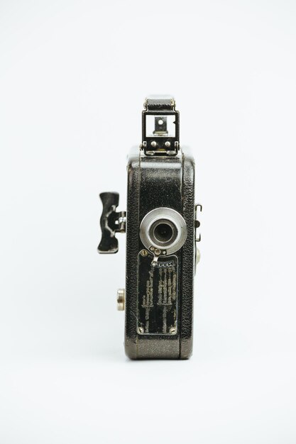 Photo close-up of vintage camera over white background