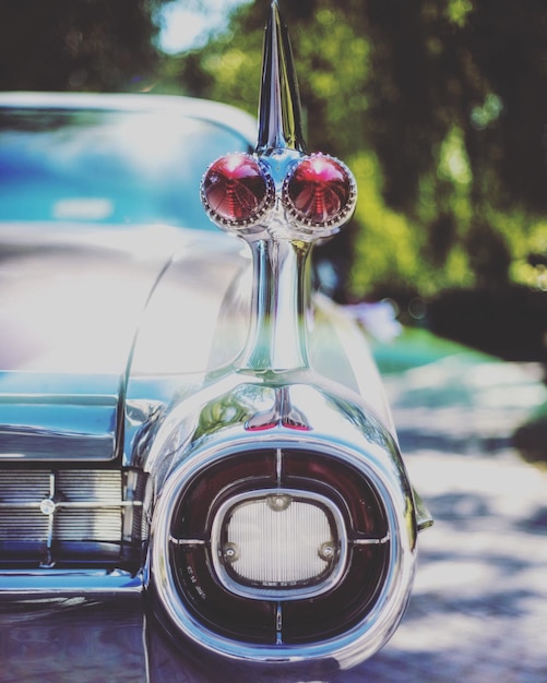 Close-up of vintage car on road