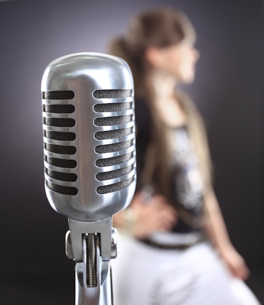 Close up vintage microphone on the stage background