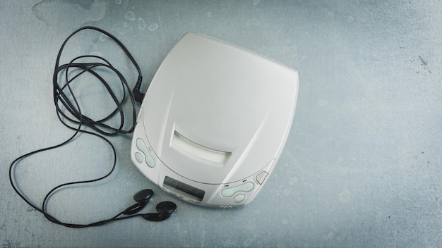 Close up of a vintage portable compact disc player on metal background