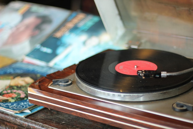 Close-up of vinyl record player playing music