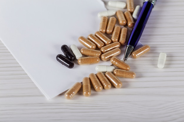 Close up vitamin pill on wood table, healthy concept