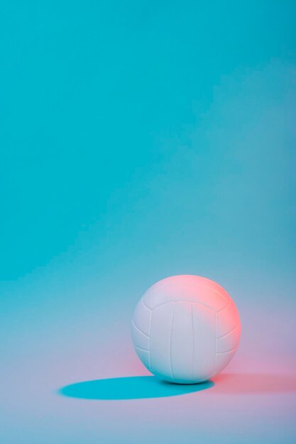 Photo close-up of volleyball over colored background