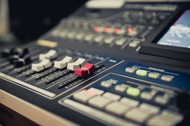 Close-up of a volume slide control on Professional sound mixer.