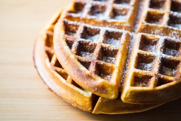 close-up of waffle on wooden table