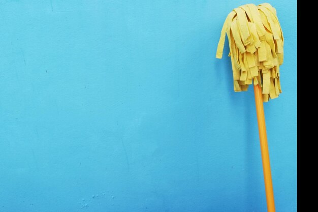 Close-up of wall with blue paint on table