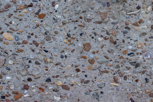 Close up of a wall with pebbles. Textured wall.