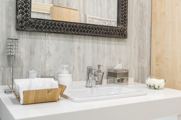 Photo close-up of a washbasin with a faucet in the bathroom