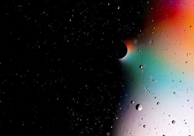 A close up of water droplets on a black background