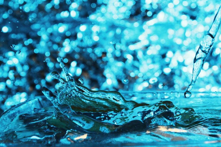 Photo 青い表面上の水滴のクローズアップ
