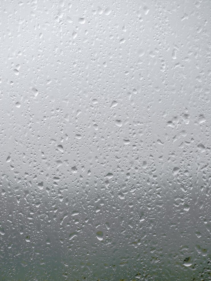 Photo close-up of water drops on glass