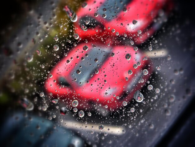 Photo close-up of water drops on glass