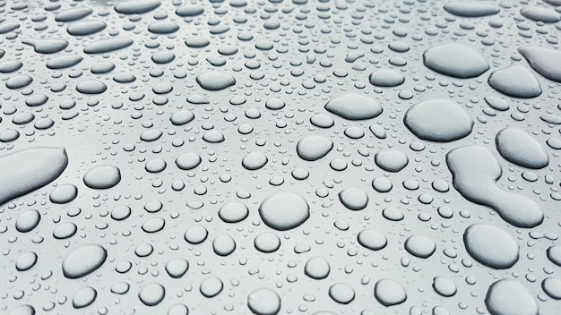 Photo close-up of water drops on glass