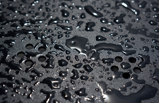 Close up water drops on metal surface can be used for web design. Abstract texture background