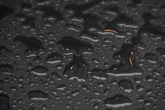 Close up water drops on metal surface can be used for web design. Abstract texture background