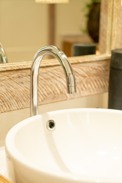 close-up water faucet in bathroom