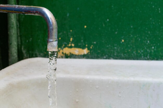 Close-up of water flowing from faucet