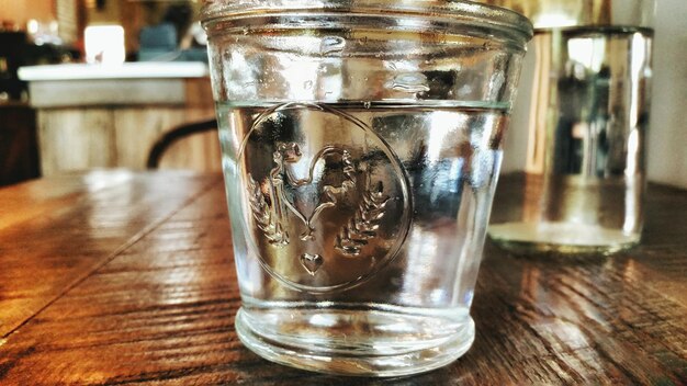 Close-up of water glass on table